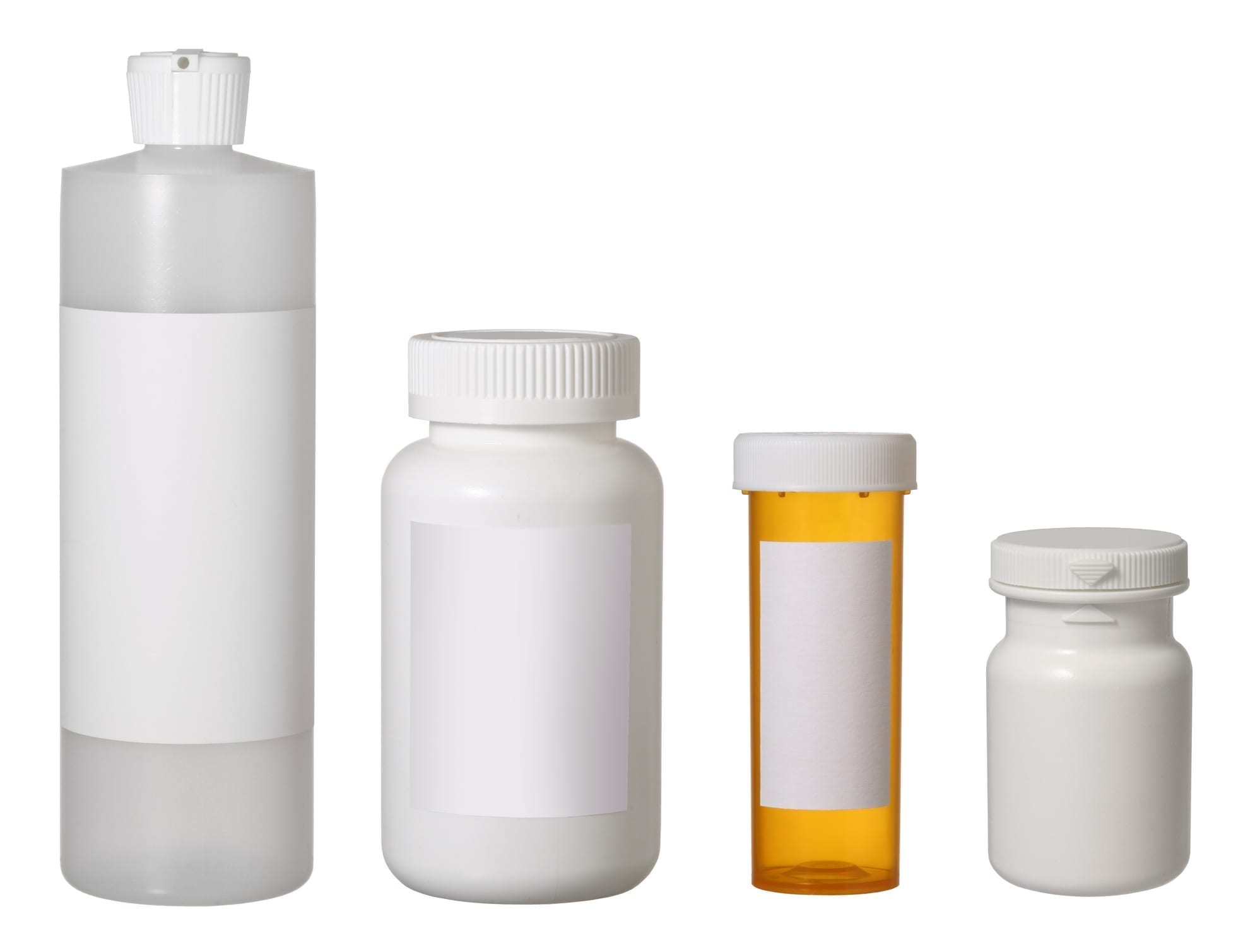 four empty bottles with blank prescription labels